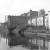 Zicht op de Schelde achter de Sint-Pietersnieuwstraat met de Stedelijke School voor Jongelingen die in de jaren 1970 zal plaatsmaken voor een nieuwe vleugel van het rectoraat (Collectie Universiteitsarchief Gent - foto A. Van Lancker).